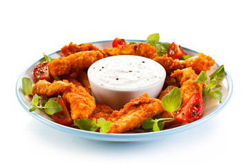 Fried chicken nuggets and vegetables