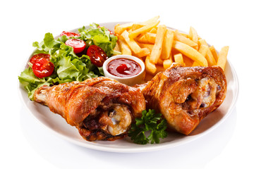 Grilled turkey legs with chips and vegetables 