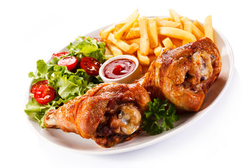 Grilled turkey legs with chips and vegetables 