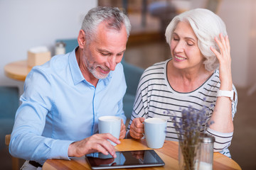 Cheerful couple drinking coffee