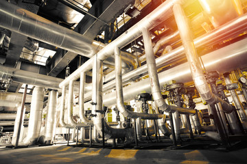 Equipment, cables and piping as found inside of a modern industr