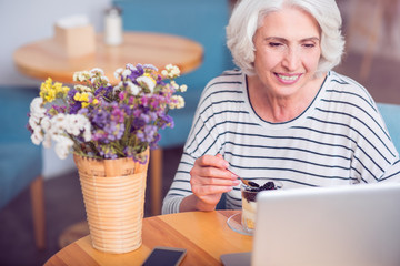 Positive woman resting in the cafe