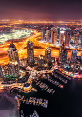 Naklejka premium Majestic colorful dubai marina skyline during night. Multiple tallest skyscrapers of the world. Dubai marina, United Arab Emirates.