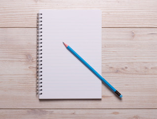 Notebook and pencil on desk