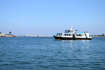 SEVASTOPOL, RUSSIA - JULE 12.2016: pleasure boat sails near the waterfront