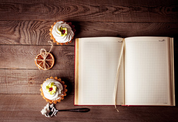 Pink cupcakes on wooden background