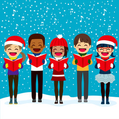 Happy children friends from different ethnicities singing carols at Christmas night