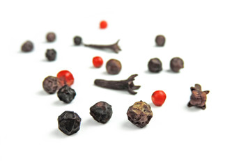 Pepper and cloves, isolated on white background