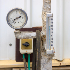 Old metallic thermometer and manometer