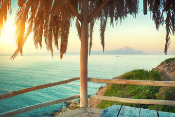 Beautiful tropical seascape with palm frame