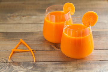 Carrot juice in glass on  table