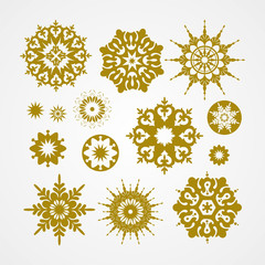 Collection of golden snowflakes on a white background