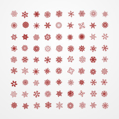 Collection of red snowflakes on a white background.