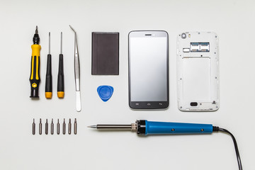mobile phone parts and repairing tools, flat lay, top view