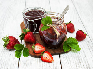 Strawberry jam and fresh strawberries