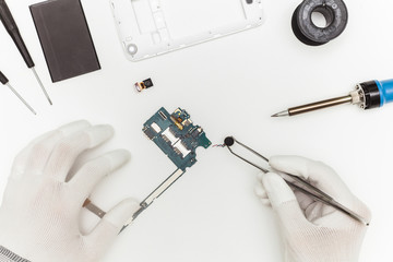 Mobile phone repairing process, flat lay, top view