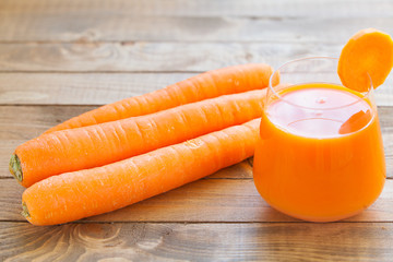Carrot juice in glass on  table