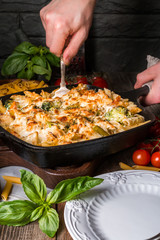 Baked pasta with broccoli, cauliflower, cheese and bechamel sauc