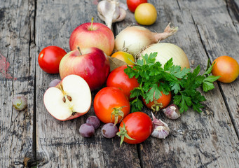 vegetables and herbs on wooden background