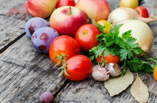 vegetables and herbs on wooden background