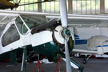 General prop aircraft motor maintenance in hangar
