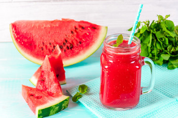 Fresh watermelon Smoothie juice on blue vintage rustic wood background