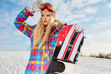 blonde snowboarder girl  on snow