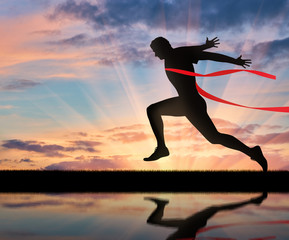 Running sports. Man runner and red tape