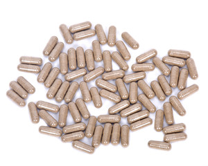 Natural vitamin supplement pills on white background
