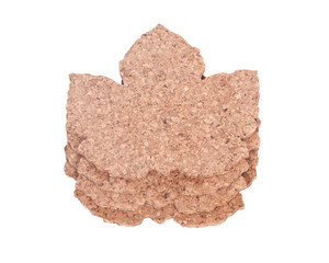 Maple leaf shape cork pads separated on white background