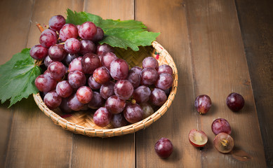 fresh grape on bamboo basket.