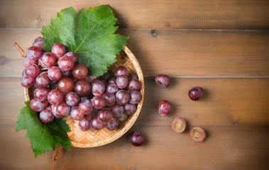 fresh grape on bamboo basket.