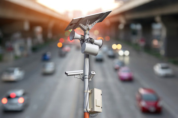 Closeup of traffic security camera surveillance (CCTV) on the road in the city.