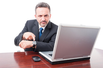 Serious lawyer showing his wristwatch