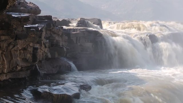 View to the Hukou waterfall at Yellow river (Huang He) in Yichuan, China. Hukou is the largest waterfall at Yellow river and the second largest in China.