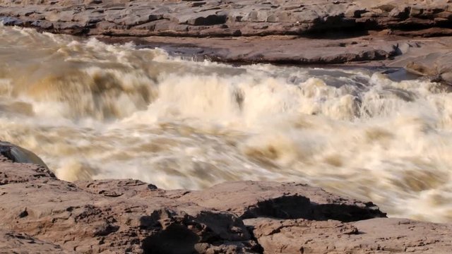View to the Hukou waterfall at Yellow river (Huang He) in Yichuan, China. Hukou is the largest waterfall at Yellow river and the second largest in China.