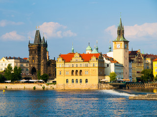 Fototapeta na wymiar Smetana embankment with Old Town Bridge Tower, Smetana's Museum and Old Town Water Tower, Prague, Czech Republic