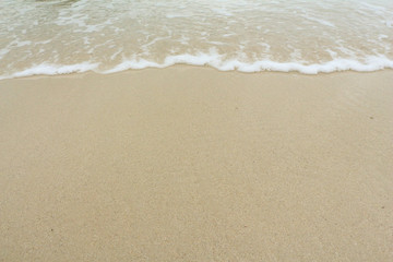 Fototapeta na wymiar Wave and sand.