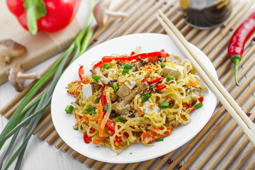 Traditional Asian meal made of rice noodles, vegetables, tofu and shiitake mushroom. Oriental cuisine food.