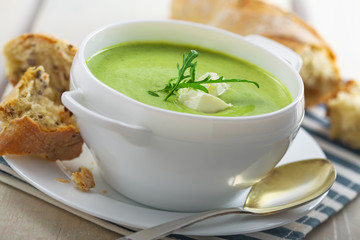 Delicious broccoli cream soup with rye bread . International cuisine meal.Close-up shot.