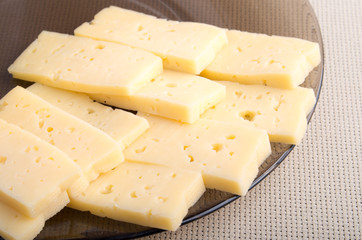Group pieces of hard dry yellow cheese