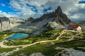 Colorful lake and hackly mountain ridges,Monte Paterno,Dolomites,Italy - obrazy, fototapety, plakaty