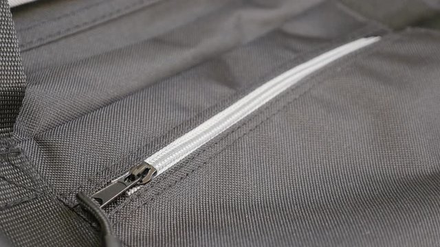 Clossing with zipper travel case and fabric details slow tilt 4K 2160p 30fps UltraHD footage - Modern travel bag with lot of details 4K 3840X2160 UHD tilting video 