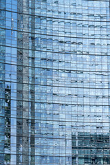 Fototapeta na wymiar Blue mirror glass building