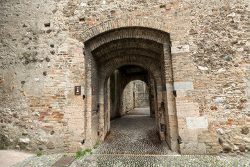 Fototapeta na wymiar The entry to the castle Scaliger in old town Sirmione on lake Lago di Garda. Italy