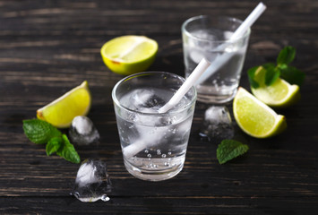 Cocktail with soda water, ice, lime and mint