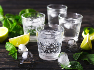 Cocktail with soda water, ice, lime and mint