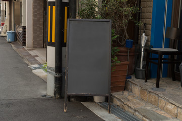 Large blank billboard on a street wall, banners with room to add your own text