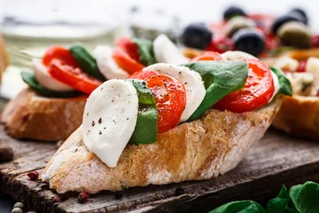 Foto op Plexiglas Bruschetta with tomatoes, mozzarella and basil © Vankad