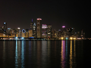 Fototapeta na wymiar Chicago skyline at night across water with reflections